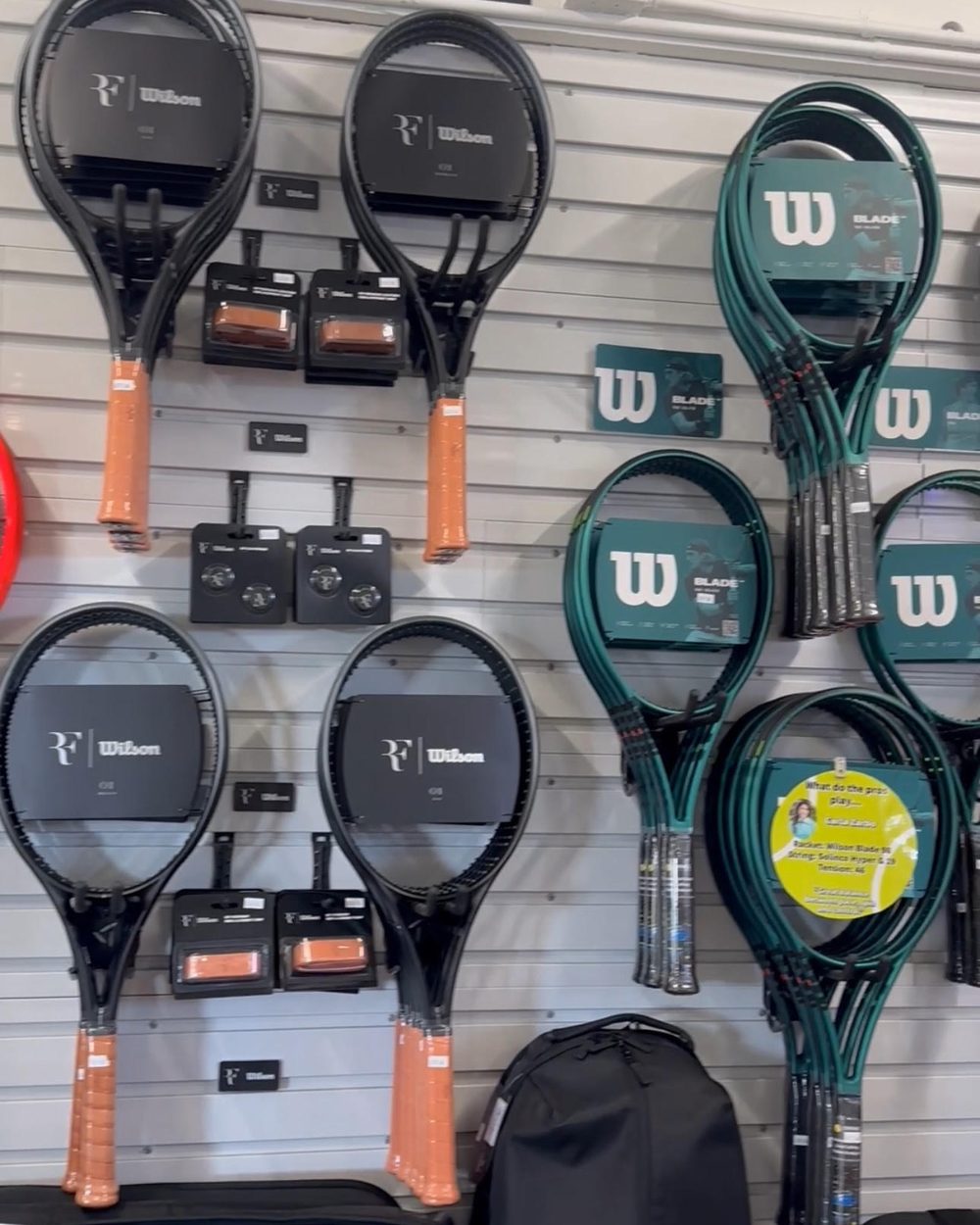 Wilson rackets hanging on the pro shop demo wall